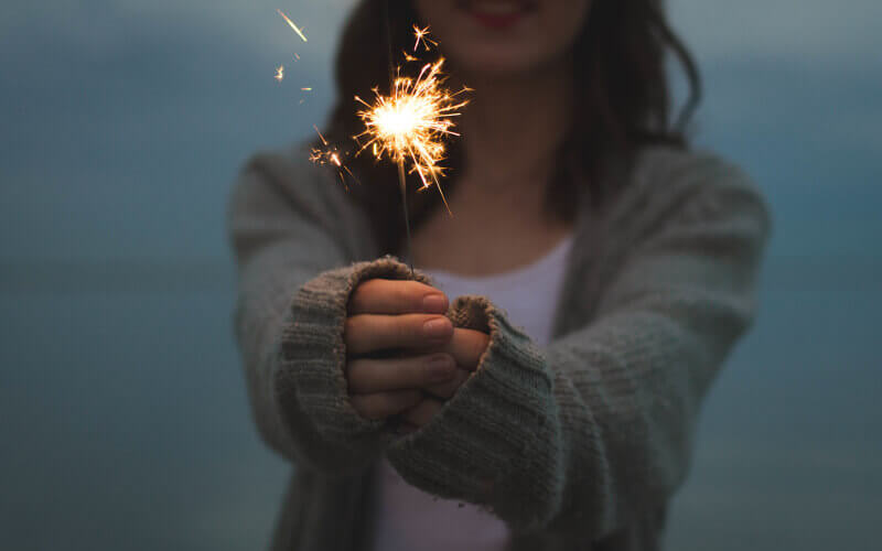 Woman holding sparkler